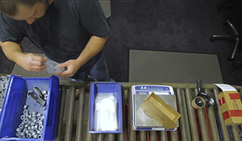 employee baging fastener parts for sub-assembly