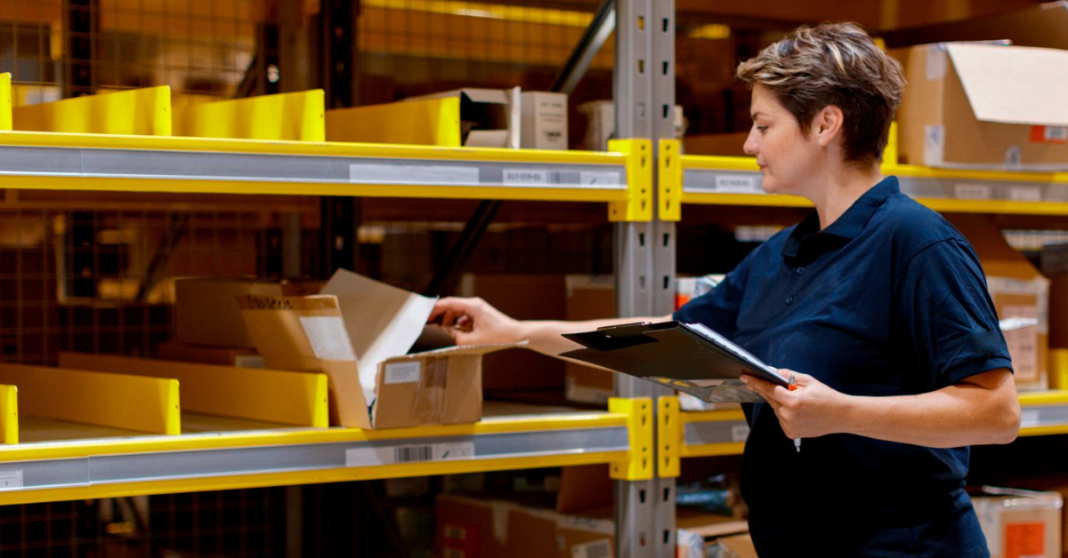 industrial warehouse employee organizing mro product inventory