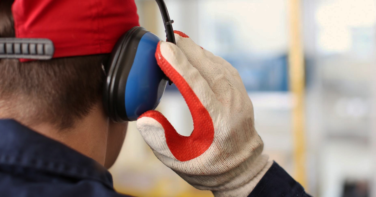 hearing and hand protection ppe on employee