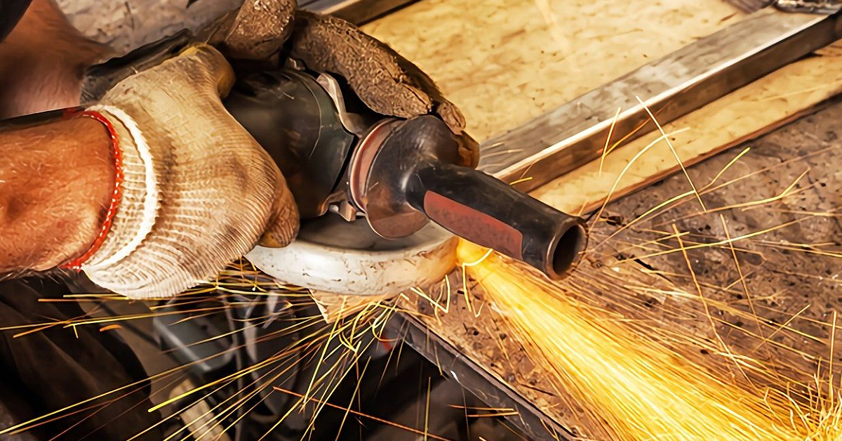 industrial grinding wheel with sparks in dark room