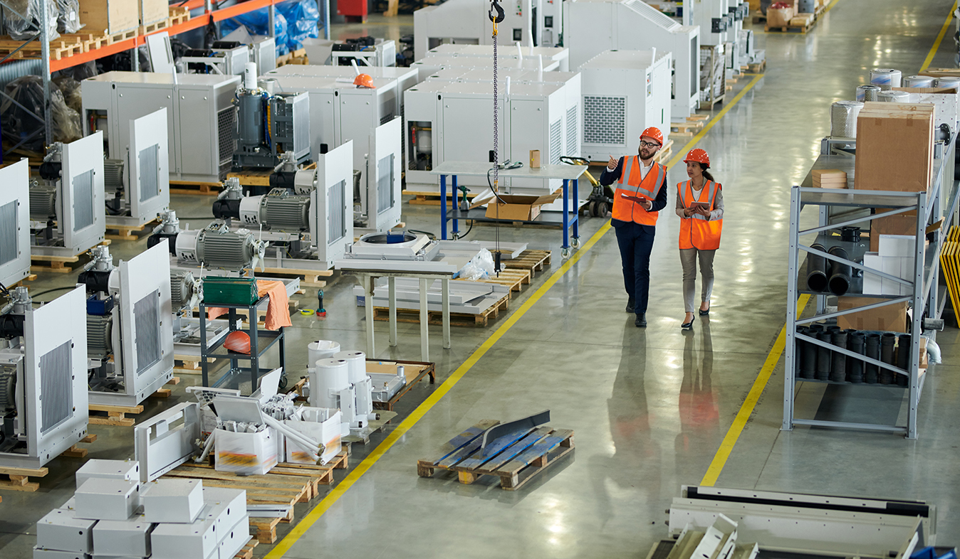Employees explore factory warehouse