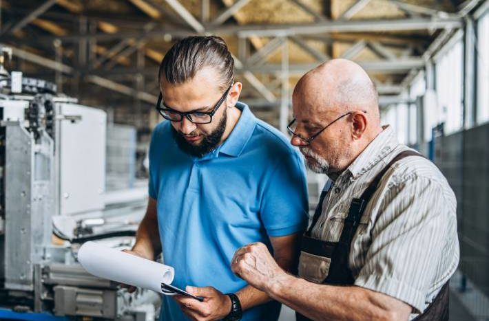 Employees discuss maintenance plan