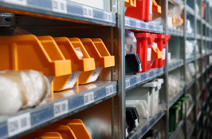 Storage bins and racks in a warehouse ideal for inventory management and stock concepts