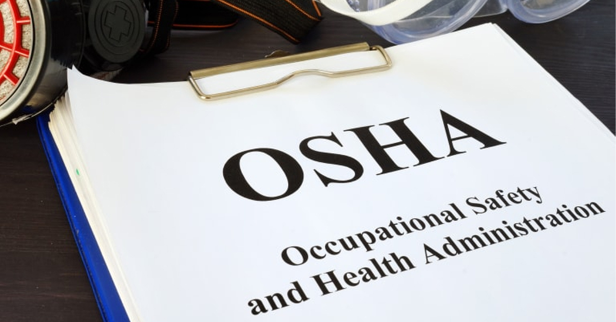OSHA regulation printout on clipboard