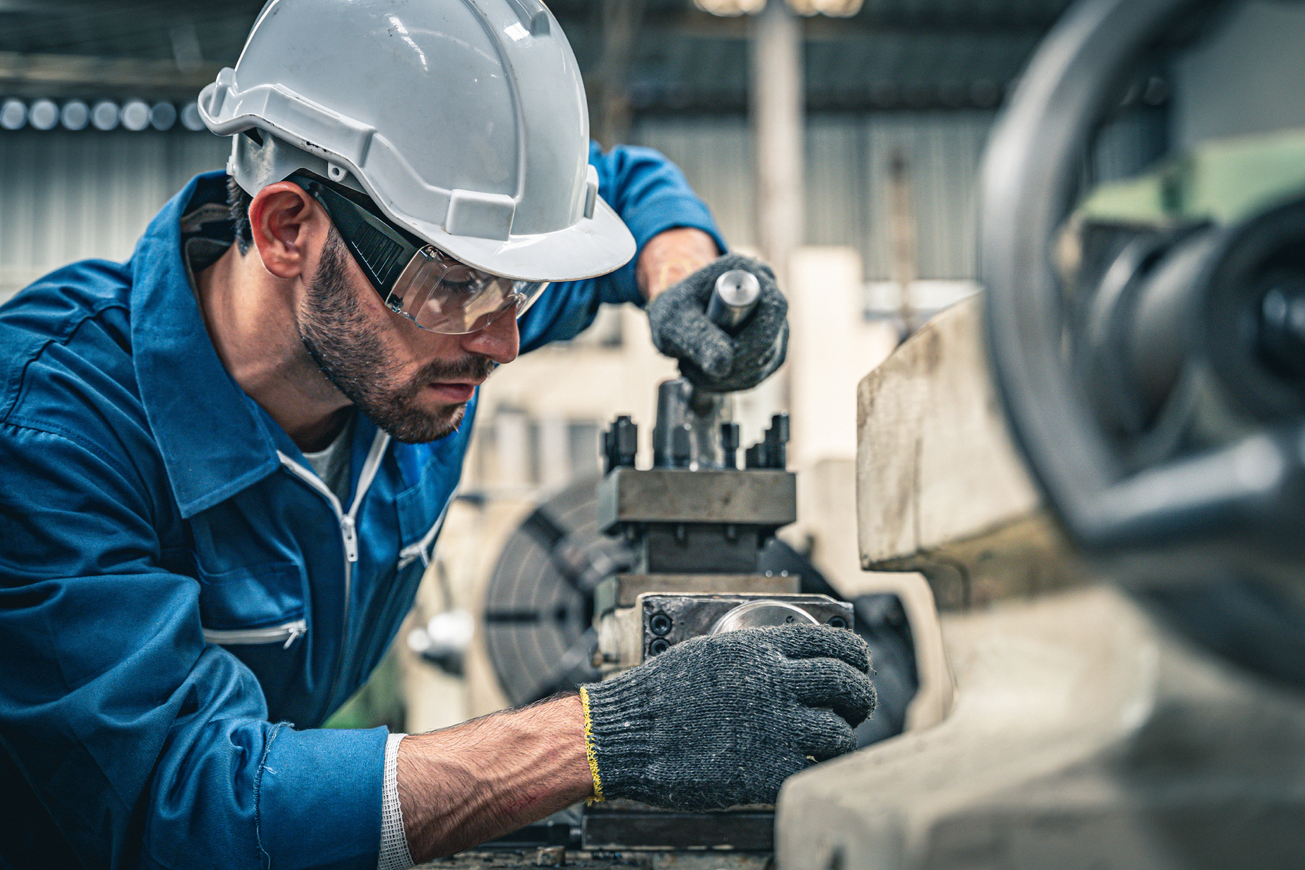 Employee performs maintenance upgrade on machinery