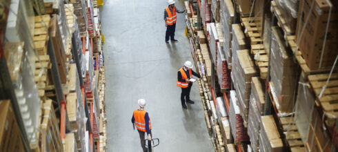 storeroom employee organizing inventory in warehouse