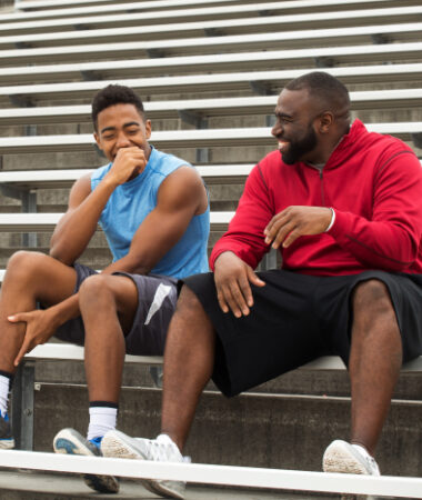 Safety employee at practice with son