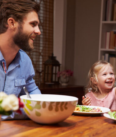 Safety employee enjoying meal with wife and daughter