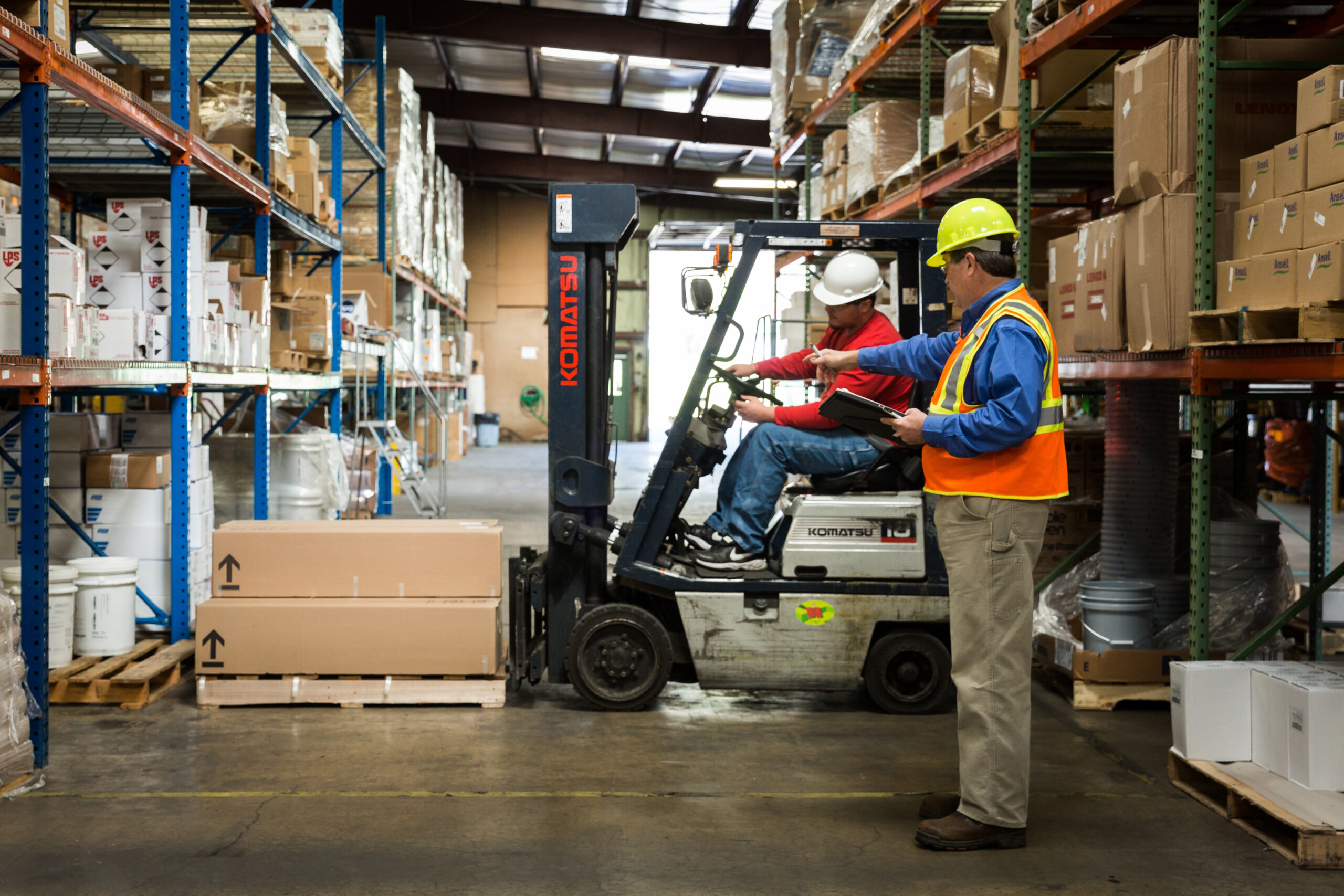 Employees using forklift for heavy products