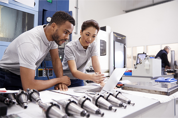 Employees evaluating metalworking issues