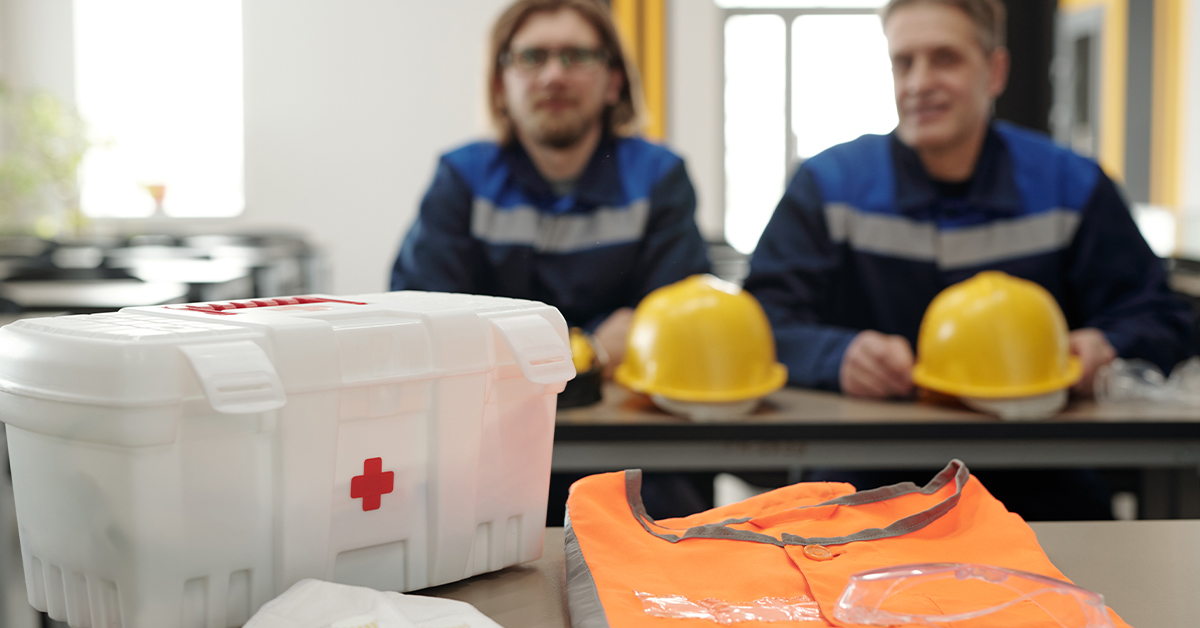 safety employees with first aid kit
