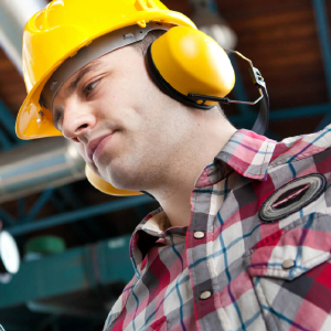 Employee with helmet and headphone PPE