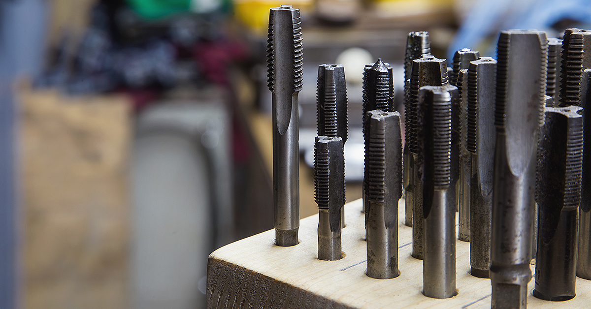 Variation of cut and roll (form taps) on display in industrial storeroom