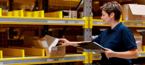 industrial warehouse employee organizing mro product inventory