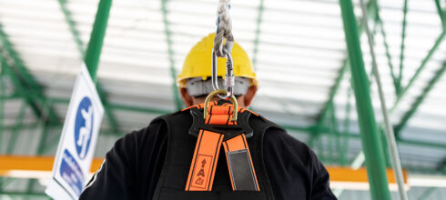 Safety worker using harness at height