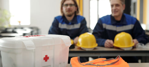 safety employees with first aid kit