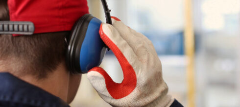 hearing and hand protection ppe on employee