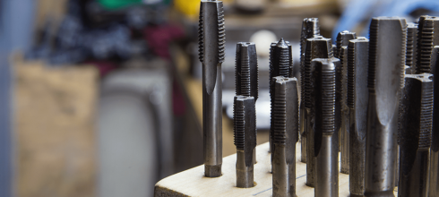 Variation of cut and roll (form taps) on display in industrial storeroom