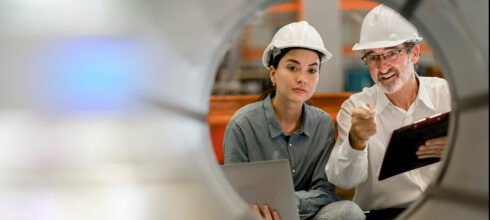 Safety trainer showing third party contractor woman safety precautions in confined spaces