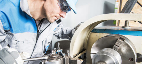 metal shop worker using metalworking tools through tool management system